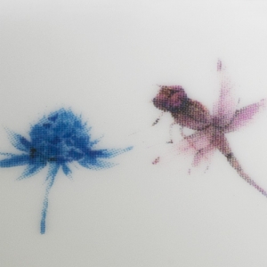 Close up of the Dragonfly print on a ceramic mug
