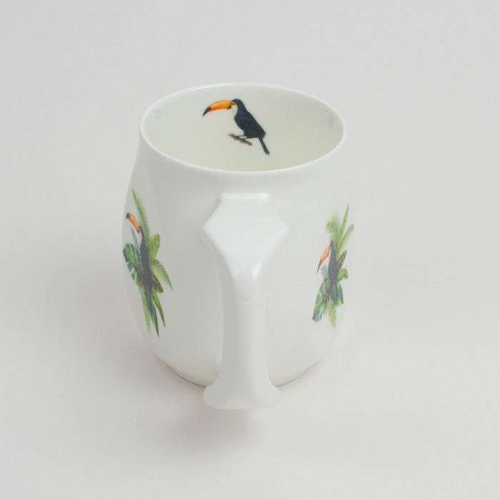 White fine bone china mug with a colourful toucan printed on the side.