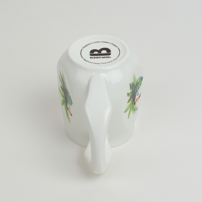 White ceramic mug with a colourful toucan printed on the side.